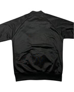 GEGENHALT. Fred Perry Argyle Track Jacket, schwarz, Polyester, mit durchgehendem Reißverschluss und Rippstrickbündchen.
